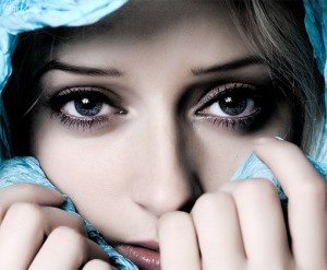 portrait of a woman touching her face with her hands