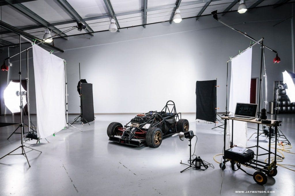 a race car inside a photo studio