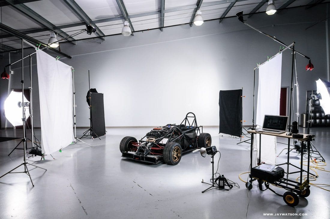 a race car inside a photo studio