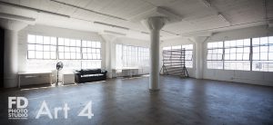 photo studio with wood wall and corner with large wood blinds