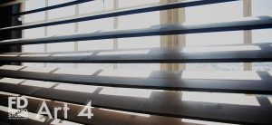photo studio with wood wall and corner with large wood blinds