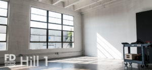 Rent Photo Studio Los Angeles Hill 1 natural light stage with artsy kitchen table