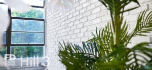 Photo & video natural light studio rental in Los Angeles with White Brick Wall
