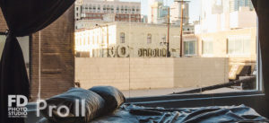 LA Photo & Video studio rental with a queen bed and urban views