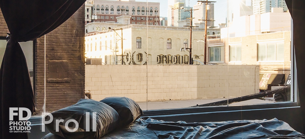 LA Photo & Video studio rental with a queen bed and urban views