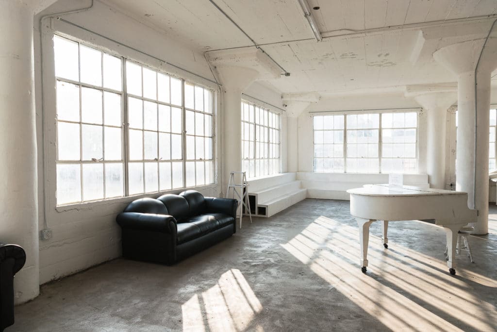 natural light photo studio with white staircase
