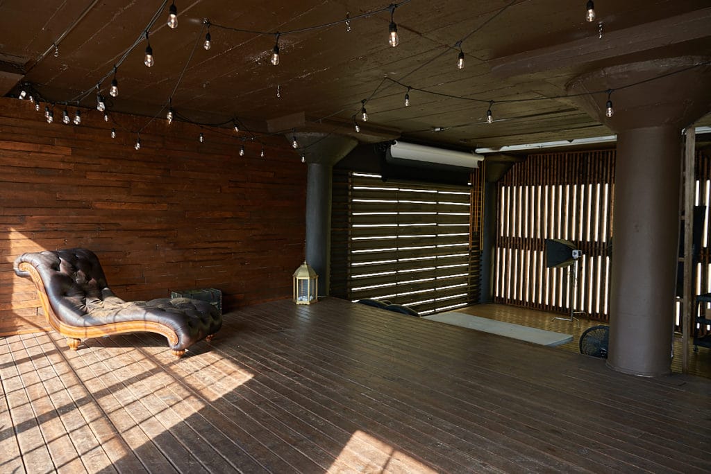 Wooden stage with LED lamps available for photo and video rental in Los Angeles