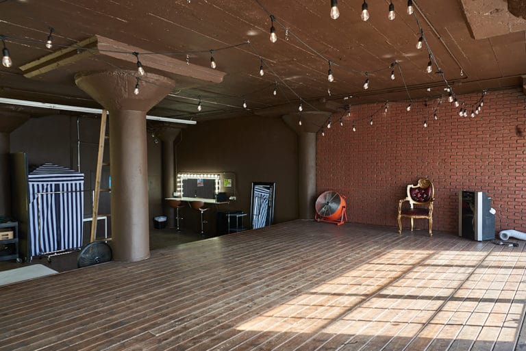 Wooden stage with LED lamps available for photo and video rental in Los Angeles