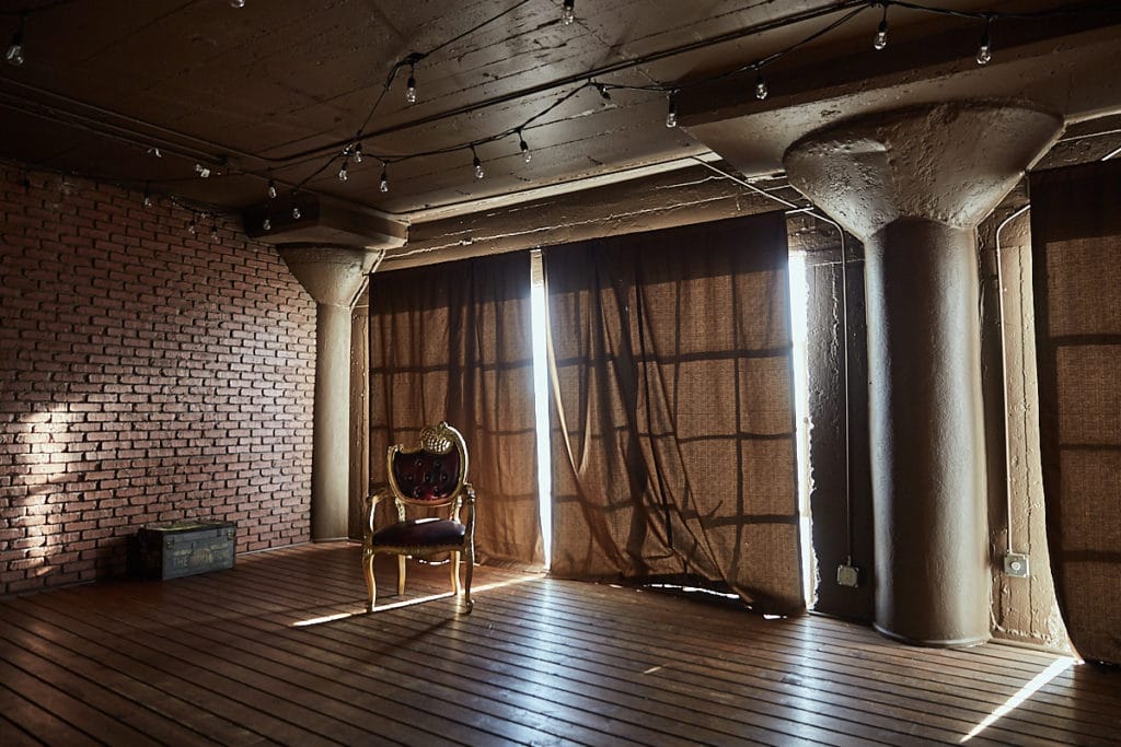 Wood stage with curtains available for photo and video rental in Los Angeles