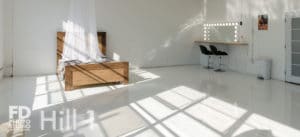 Natural light photo studio with high-gloss white floors available for rental in Los Angeles