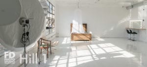 Natural light photo studio with high-gloss white floors available for rental in Los Angeles