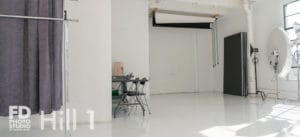 Natural light photo studio with high-gloss white floors available for rental in Los Angeles