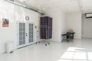 Natural light photo studio with high-gloss white floors available for rental in Los Angeles