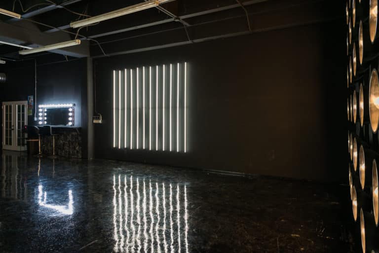 LED dimmable lights & black glossy floor blackout stage is available for photo and video rentals in Los Angeles