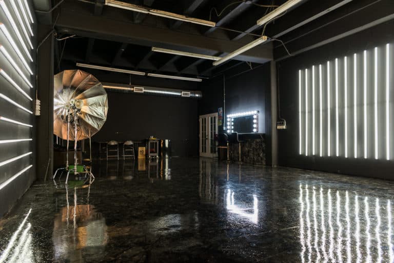 LED dimmable lights & black glossy floor blackout stage is available for photo and video rentals in Los Angeles