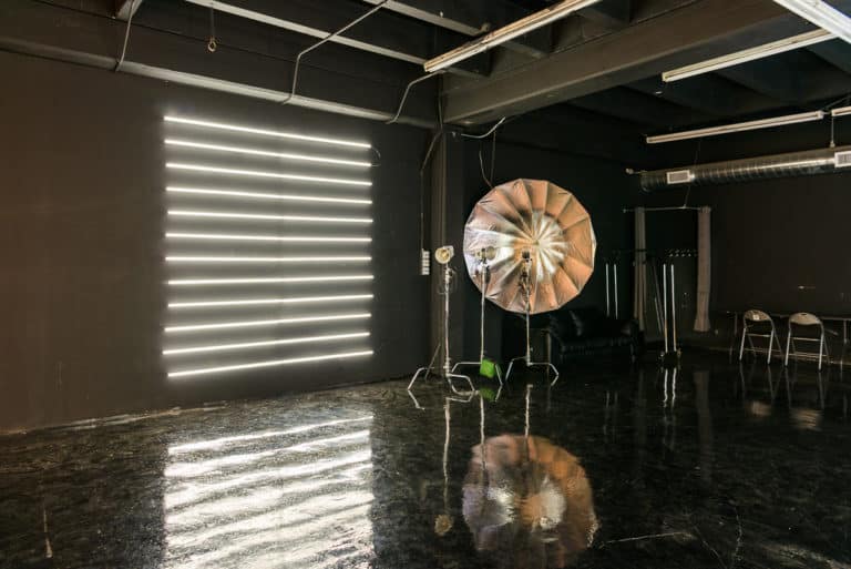 LED dimmable lights & black glossy floor blackout stage is available for photo and video rentals in Los Angeles