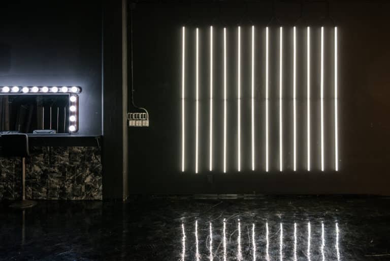 LED dimmable lights & black glossy floor blackout stage is available for photo and video rentals in Los Angeles