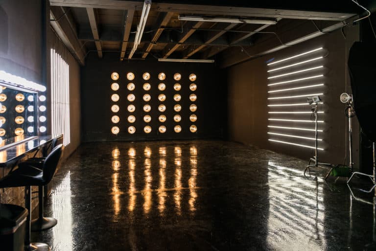 LED dimmable lights & black glossy floor blackout stage is available for photo and video rentals in Los Angeles