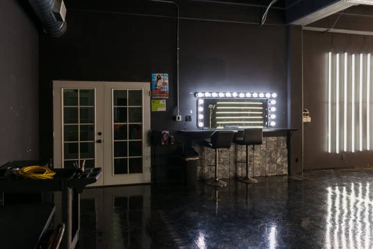 LED dimmable lights & black glossy floor blackout stage is available for photo and video rentals in Los Angeles