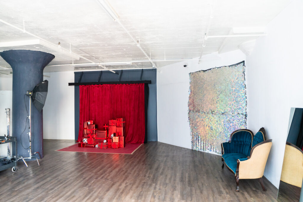 Photo studio for rent in DTLA with red velvet curtains and Christmas presents decorations - Pro I_03