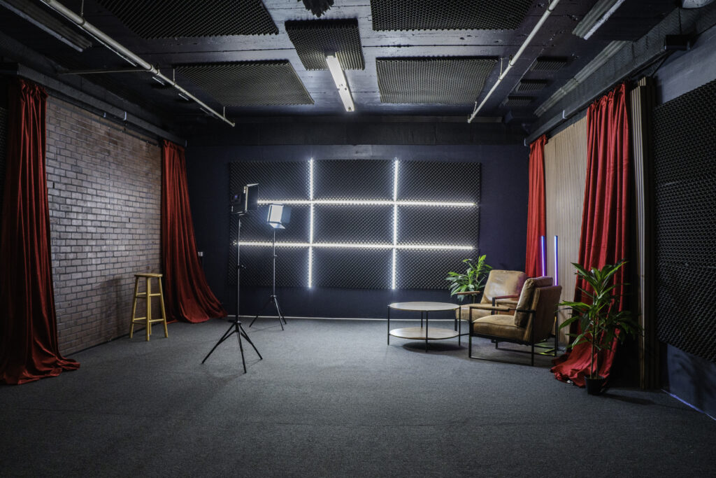 Soundproof Podcast Studio in DTLA with red curtains brick and wooden walls furniture RGB LED lights - Pro III_4