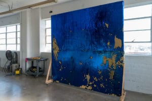 gold and royal blue sequin backdrop available with Stage C rental