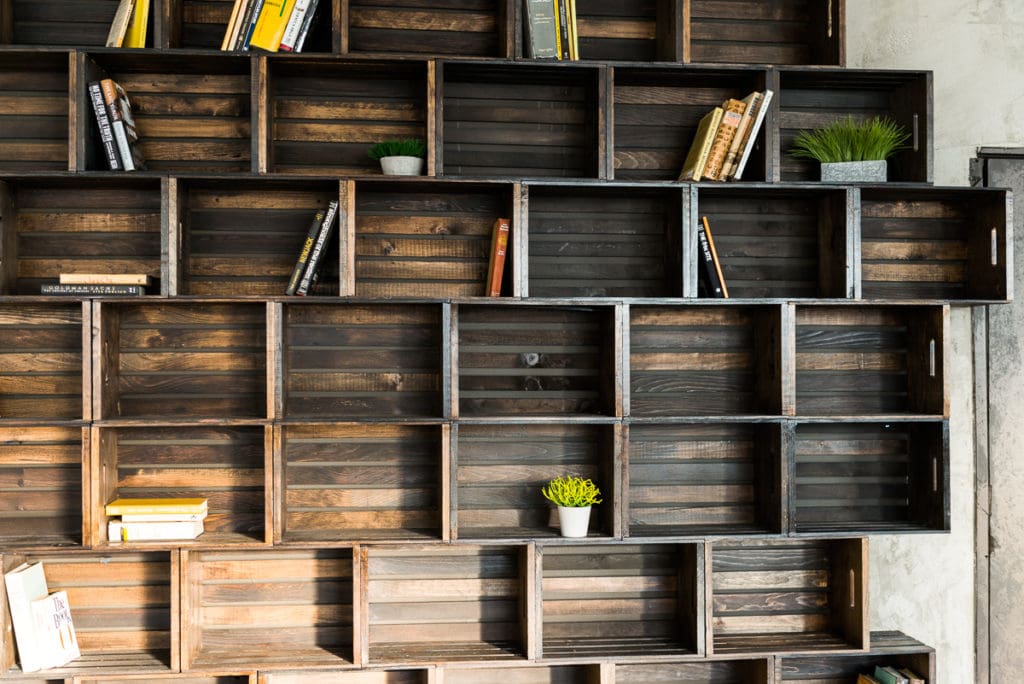 Photo Studio with Book Shelf, yellow cine cases and grey textured wall