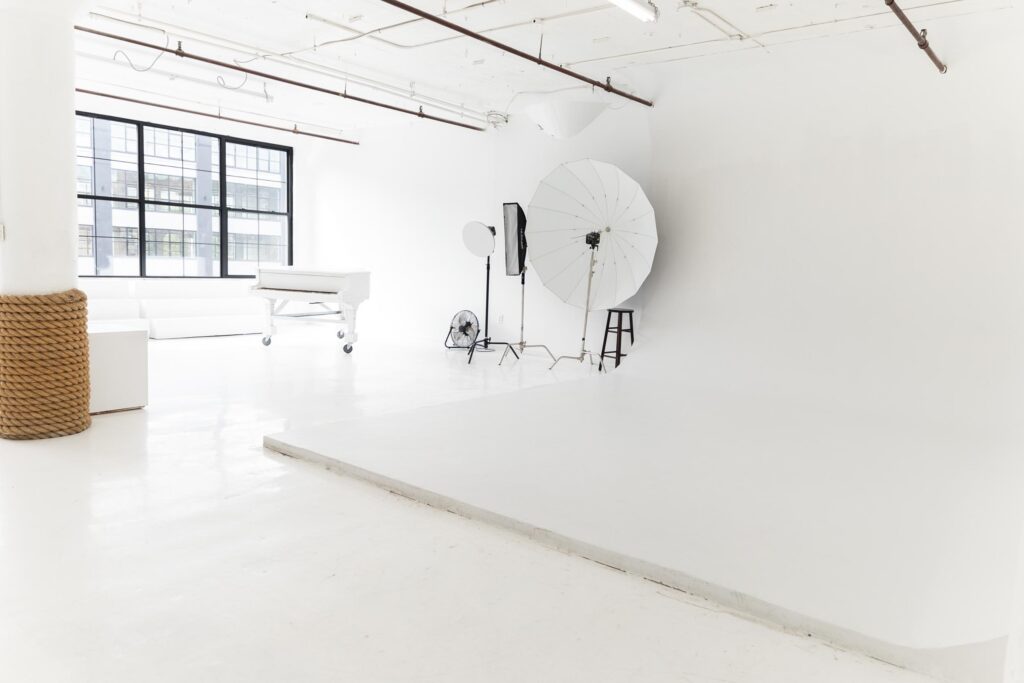 LIC 1 - photo studio with cyc wall, west-facing windows, lots of natural light, and white floors in NY