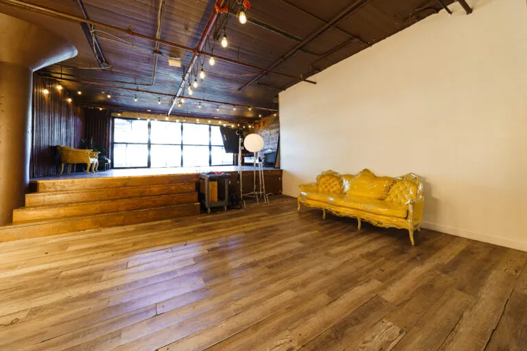LIC 2 - daylight photo studio for rent near me with brick and wooden walls and floors in New York