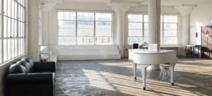 natural light photo studio with white staircase