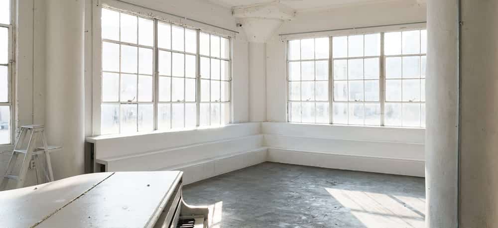 natural light photo studio with white staircase