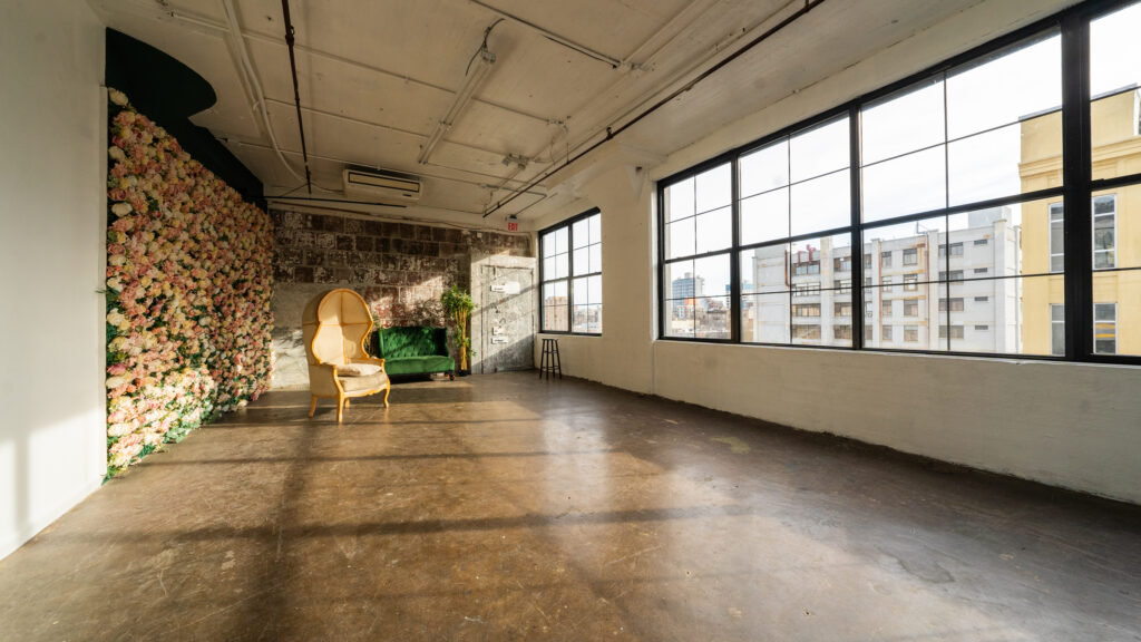 LIC 6 - photo studio with flower wall and exposed block wall in NY