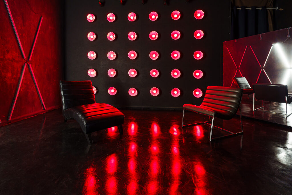LIC 4 - a Blackout Studio for rent near me New York with RGB lights, X-lights, Concrete Wall, Black gloss floor and two different French Walls
