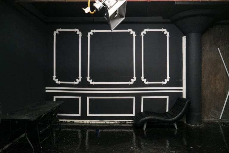 Affordable photo studio with 4 different sets, RGB lights, furniture and additional grip & strobes included, available for rent hourly near New York.