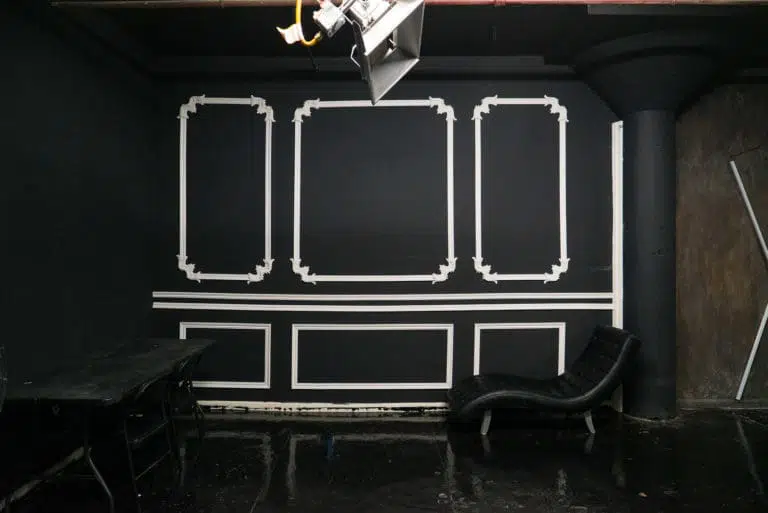 Affordable photo studio with 4 different sets, RGB lights, furniture and additional grip & strobes included, available for rent hourly near New York.