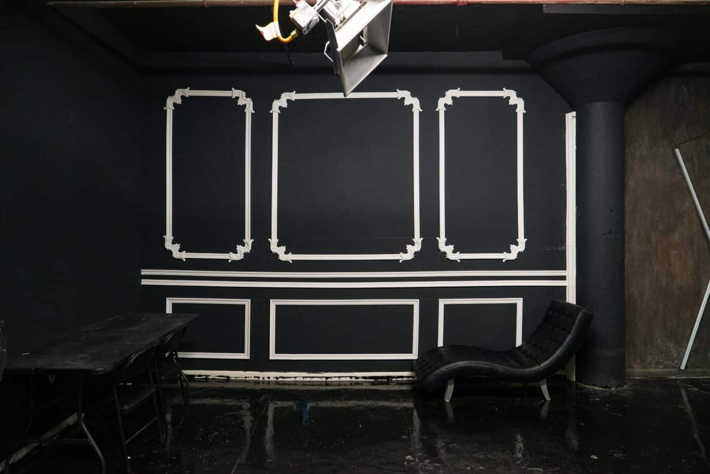 Affordable photo studio with 4 different sets, RGB lights, furniture and additional grip & strobes included, available for rent hourly near New York.