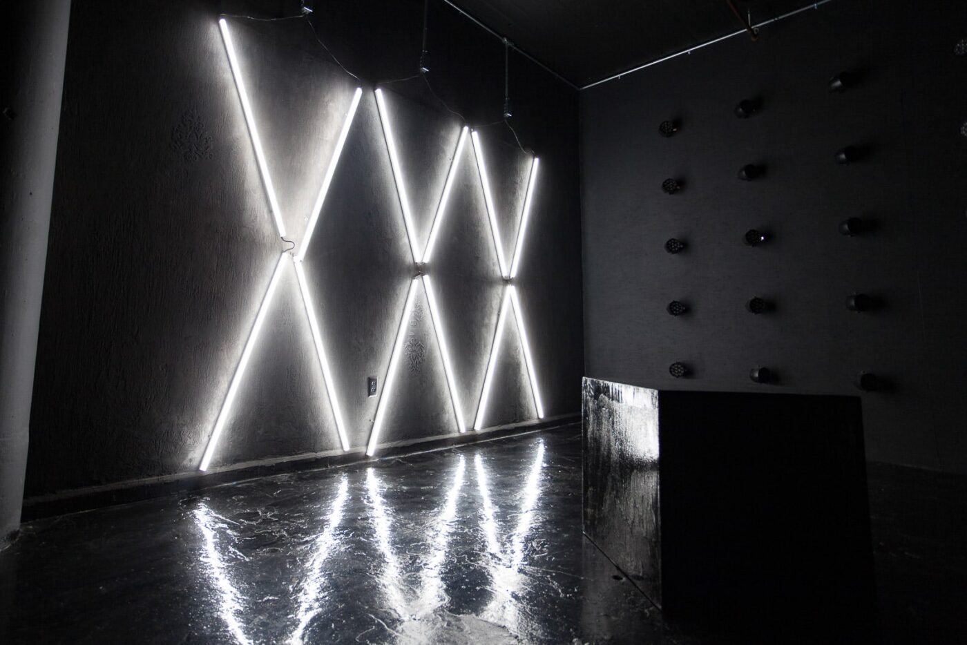 Affordable photo studio with 4 different sets, RGB lights, furniture and additional grip & strobes included, available for rent hourly near New York.