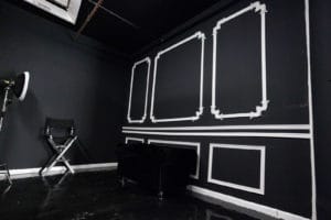 Affordable photo studio with 4 different sets, RGB lights, furniture and additional grip & strobes included, available for rent hourly near New York.