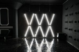 Affordable photo studio with 4 different sets, RGB lights, furniture and additional grip & strobes included, available for rent hourly near New York.