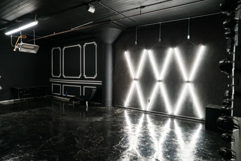 Affordable photo studio with 4 different sets, RGB lights, furniture and additional grip & strobes included, available for rent hourly near New York.