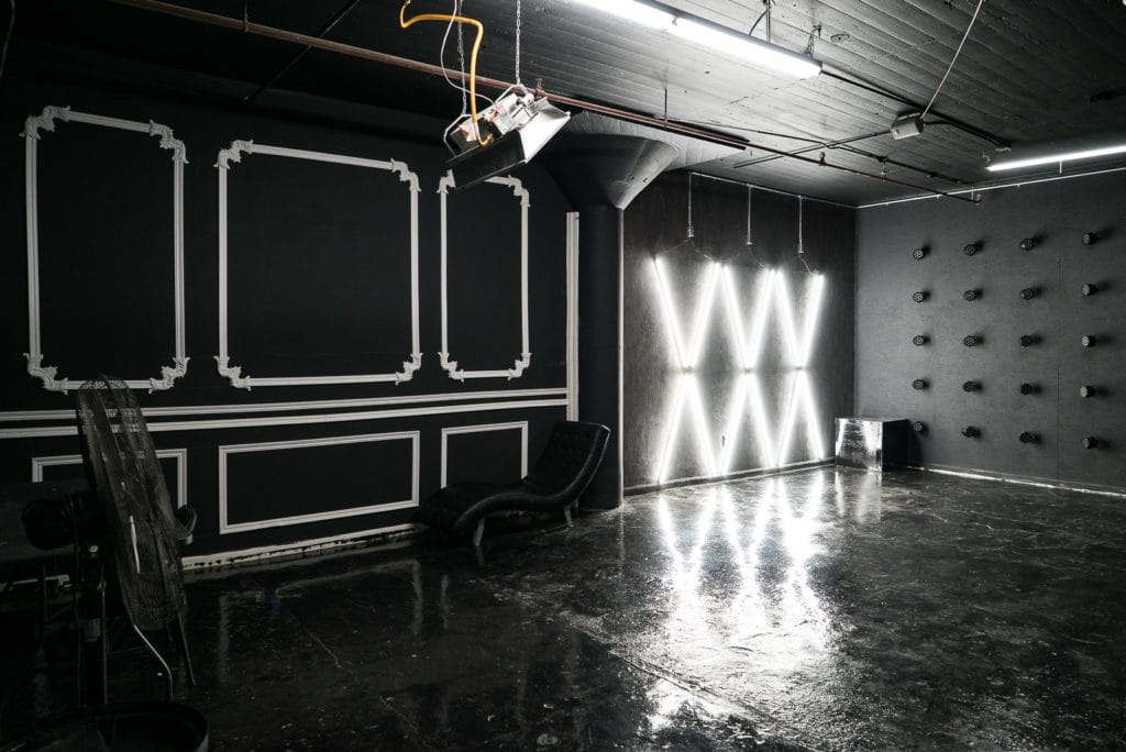 Affordable photo studio with 4 different sets, RGB lights, furniture and additional grip & strobes included, available for rent hourly near New York.