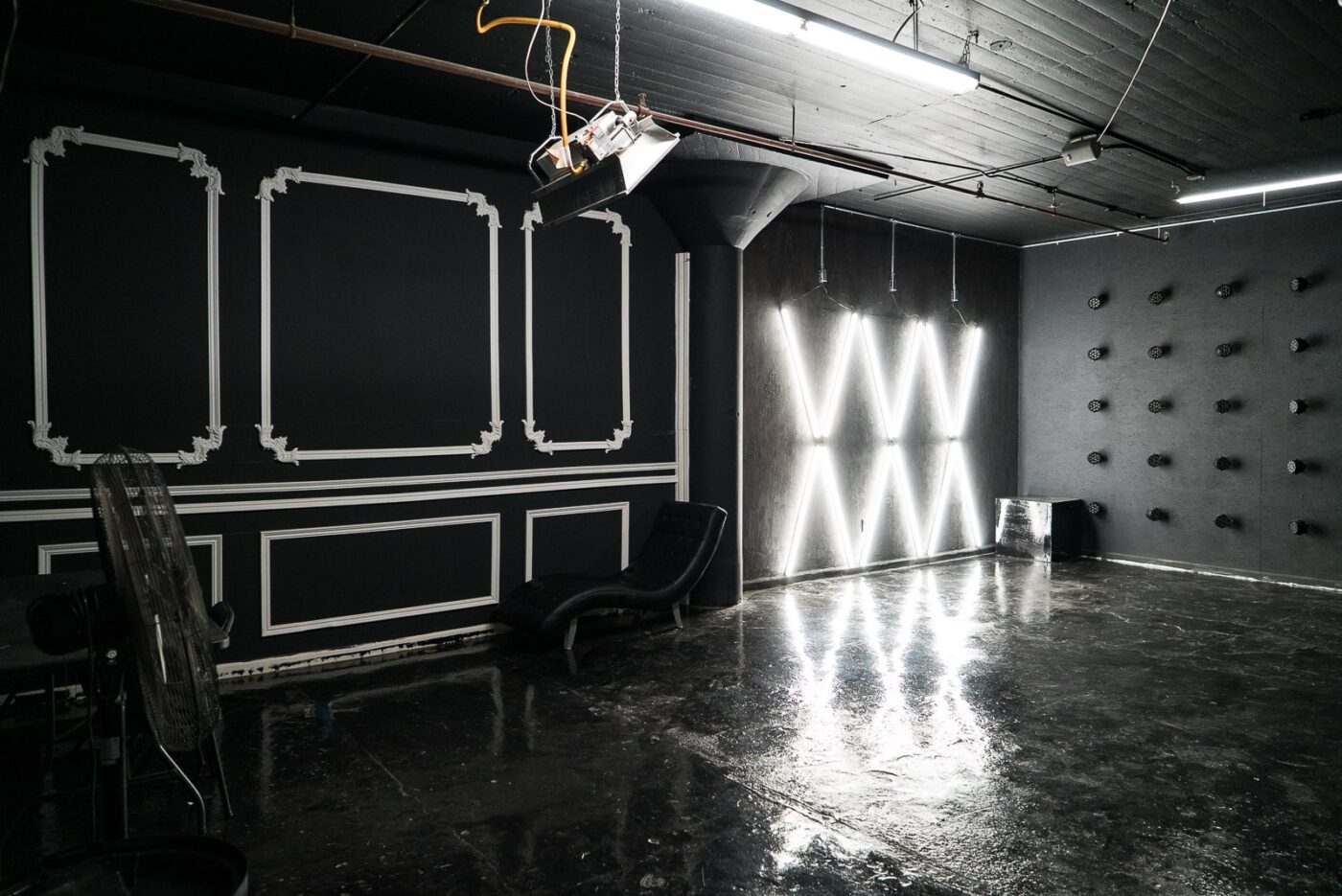Affordable photo studio with 4 different sets, RGB lights, furniture and additional grip & strobes included, available for rent hourly near New York.