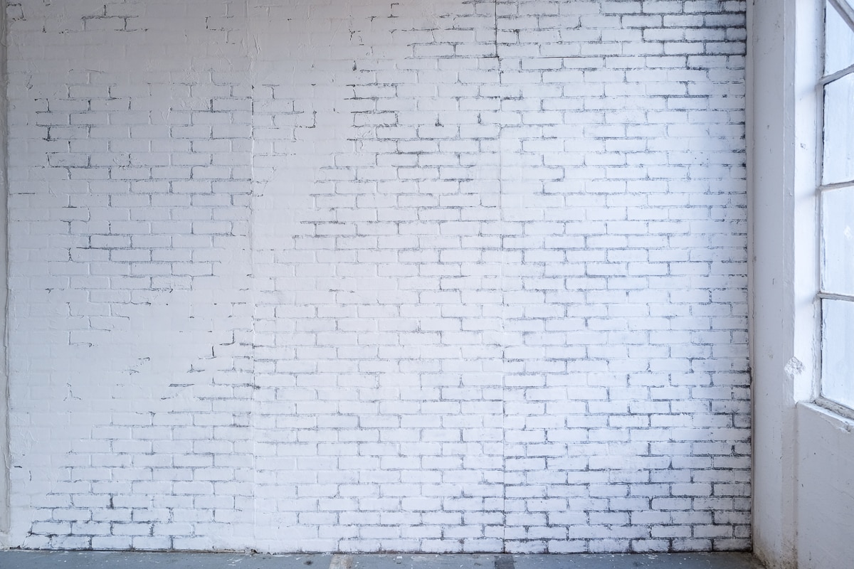 white brick wall available for photo and video rental in NYC