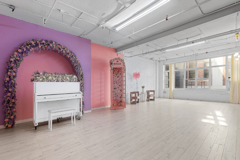 Rental photo studio with hardwood floors, big North facing window, and a pink photo booth - Astoria 3