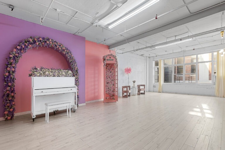 Rental photo studio with hardwood floors, big North facing window, and a pink photo booth - Astoria 3