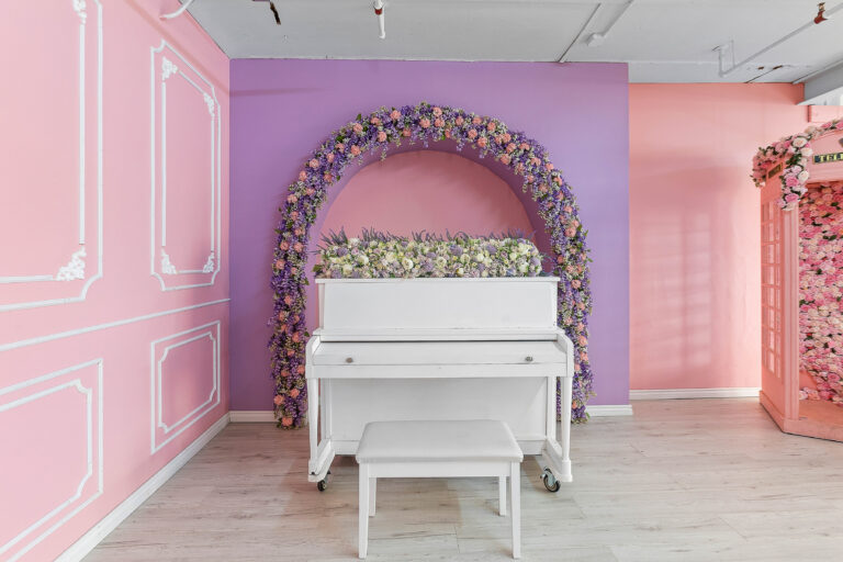 Rental photo studio with hardwood floors, big North facing window, and a pink photo booth - Astoria 3
