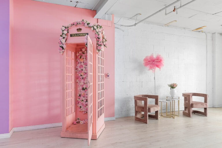 Rental photo studio with hardwood floors, big North facing window, and a pink photo booth - Astoria 3