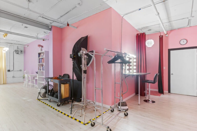 Rental photo studio with hardwood floors, big North facing window, and a pink photo booth - Astoria 3