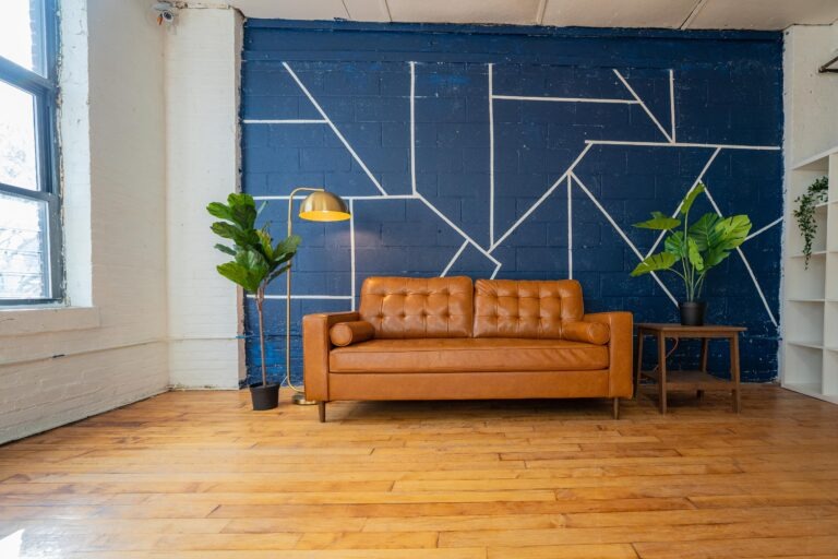 Astoria 5 - Daylight photo studio with kitchen, wood floor and cozy couch in New York