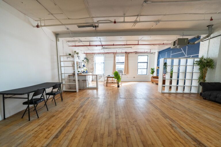 Astoria 5 - Daylight photo studio with kitchen, wood floor and cozy couch in New York